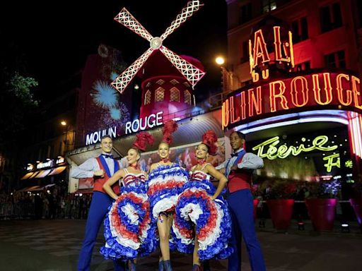 The Moulin Rouge cabaret in Paris has its windmill back, weeks after a stunning collapse