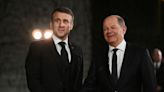 Speaking in German, France's Macron hails ties at Schaeuble ceremony