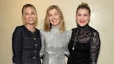 Margot Robbie Wears Dark Denim Ensemble for “Saltburn” Screening with Emerald Fennell and Rosamund Pike