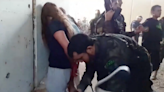 Families of female Israeli hostages taken by Hamas release graphic video of their capture