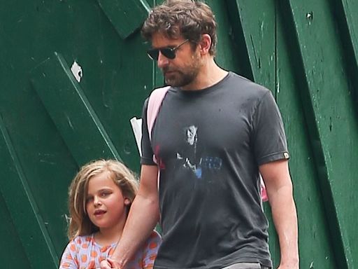 Bradley Cooper walks hand-in-hand with his daughter Lea, 7, in NYC