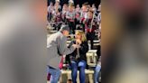 Watch this high school dance team set up their director for a surprise proposal