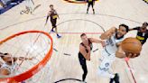 Karl-Anthony Towns #32 of the Minnesota Timberwolves shoots the ball against Nikola Jokic #15 of the Denver Nuggets during the first half in Game Seven of the Western Conference...