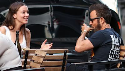 Justin Theroux looks adoringly at fiance Nicole Bloom after engagement