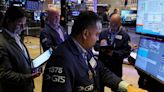 S&P 500 ends slightly down after mixed earnings, opening glitch