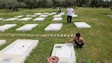 On a Greek island, volunteers remake burial site for refugees lost at sea