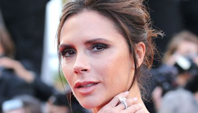 Victoria Beckham looks incredible in slick power suit and lace bra