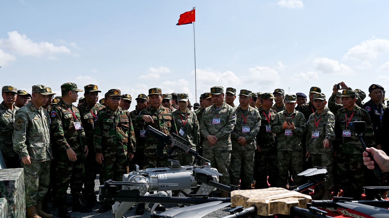 Gun-toting robot dog fetches attention at Chinese military drills