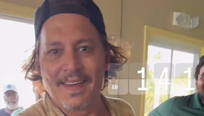 Johnny Depp unveils dental makeover a year after teeth shocked fans