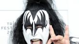 Gene Simmons performs from a chair after becoming ‘obviously sick’ during Kiss concert