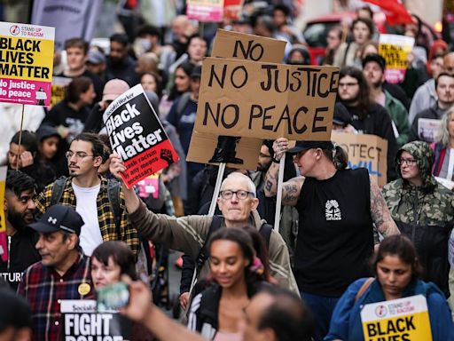 Protesters block roads and trams in Manchester after airport arrests