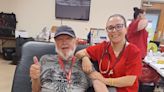 Daughter working with the Red Cross gets to help with her father's donation