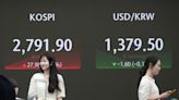 Stock market today: Asian stocks are mixed after Wall Street edges to more records