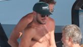 Zac Efron bares his chiseled chest as he goes shirtless on a yacht