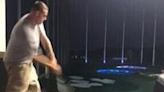 man at top golf absolutely nails a happy gilmore swing out of the arena