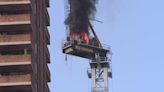 12 hurt when crane arm catches fire, collapses onto NYC street