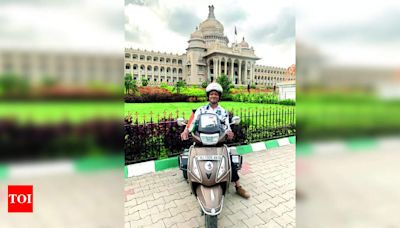 KV teacher travels 6,000km for better tri-scooter policy | Bengaluru News - Times of India