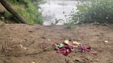 Flowers left on banks of the Tyne close to where 14-year-old boy died