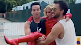 Kylie Minogue carried to BST stage in latex outfit by Andrew Scott and Jonathan Bailey