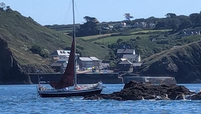 Lifeboat crew leaps into action after yacht runs aground on reef