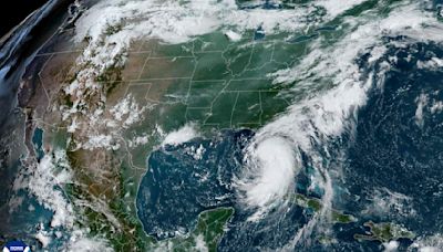 Tropical Storm Debby moves through Gulf toward Florida with hurricane warnings