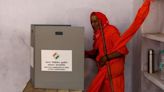 Modi's alliance to win big in India election, exit polls project