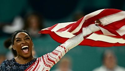 Biles eyes Olympic gymnastics glory as Marchand cruises in the pool