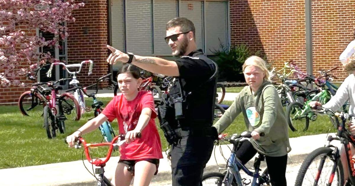 Police, ambulance staff partner with West Hancock Elementary for bike safety