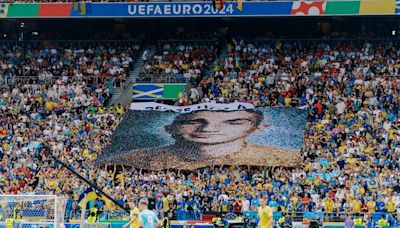 'Peace has a price': Football fans display mosaic of fallen Ukrainian soldiers at Euro 2024 match