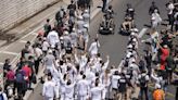 A Ukrainian gymnast carried the Paris Olympic torch with an EU team, in a sign of support