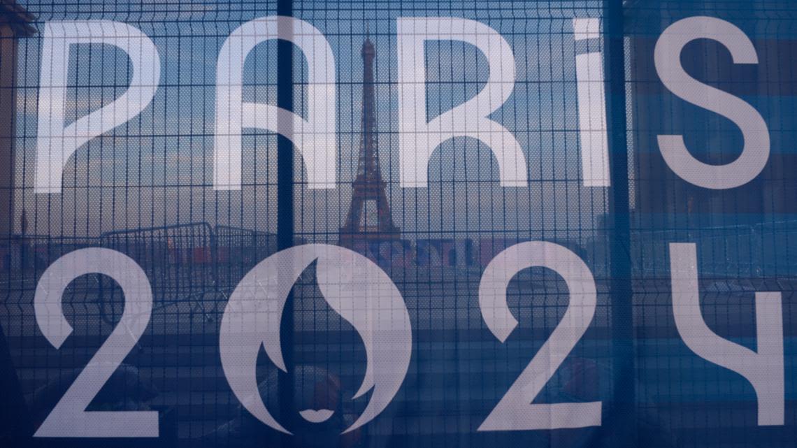 Paris Olympics off to rough start, with sabotaged trains and weather dampening mood before opening