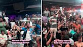 A 'bottle war' trend, where night club patrons compete by pouring their pricey liquor on the floor, is going viral and sparking a conversation about flexing and waste