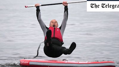 Ed Davey falls into lake five times while campaigning from paddleboard