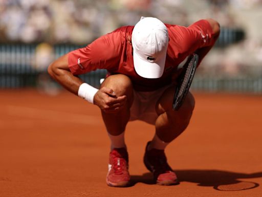 French Open LIVE: Novak Djokovic calls trainer and battles injury against Francisco Cerundolo - latest score