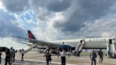 Tire on Delta flight pops while landing in Atlanta, 1 person injured, airline says