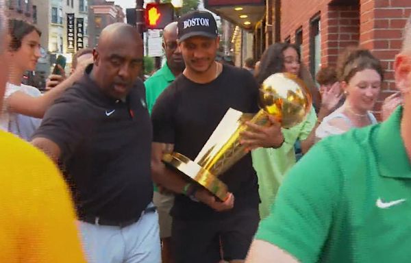 Celtics coach Joe Mazzulla takes championship trophy around North End