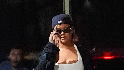 Rihanna wears a cropped vest top and sporty shorts for a stroll in NYC
