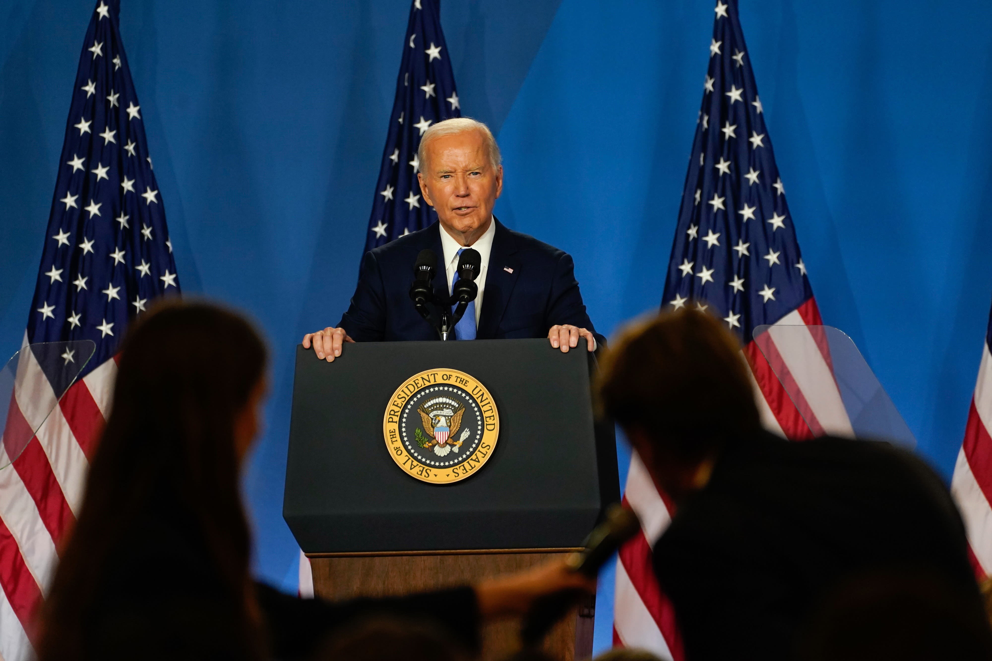 Biden shows his knowledge but stumbles over words at news conference