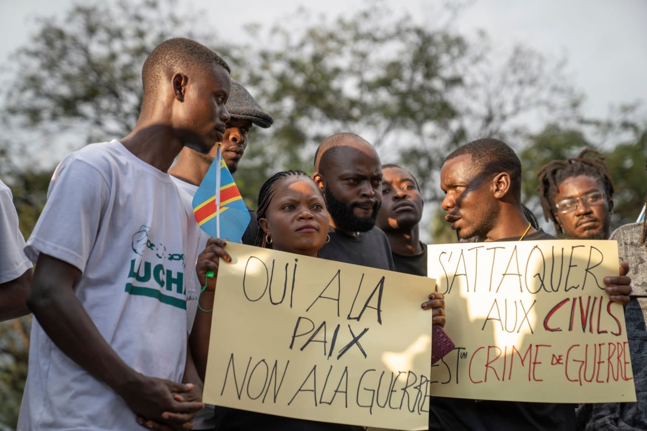 Families of the victims of attacks on displaced people in Congo mourn their dead