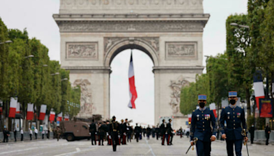 France celebrates Bastille Day as political crisis rumbles on