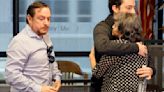 Aura Ines Nino de Henao is hugged by her son, Felipe Henao, as she leaves a news conference with Felipe and her son, Diego Henao, left, in Fort Lauderdale, ...