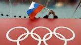 Column: IOC talks tough on Russia — until Paris on horizon