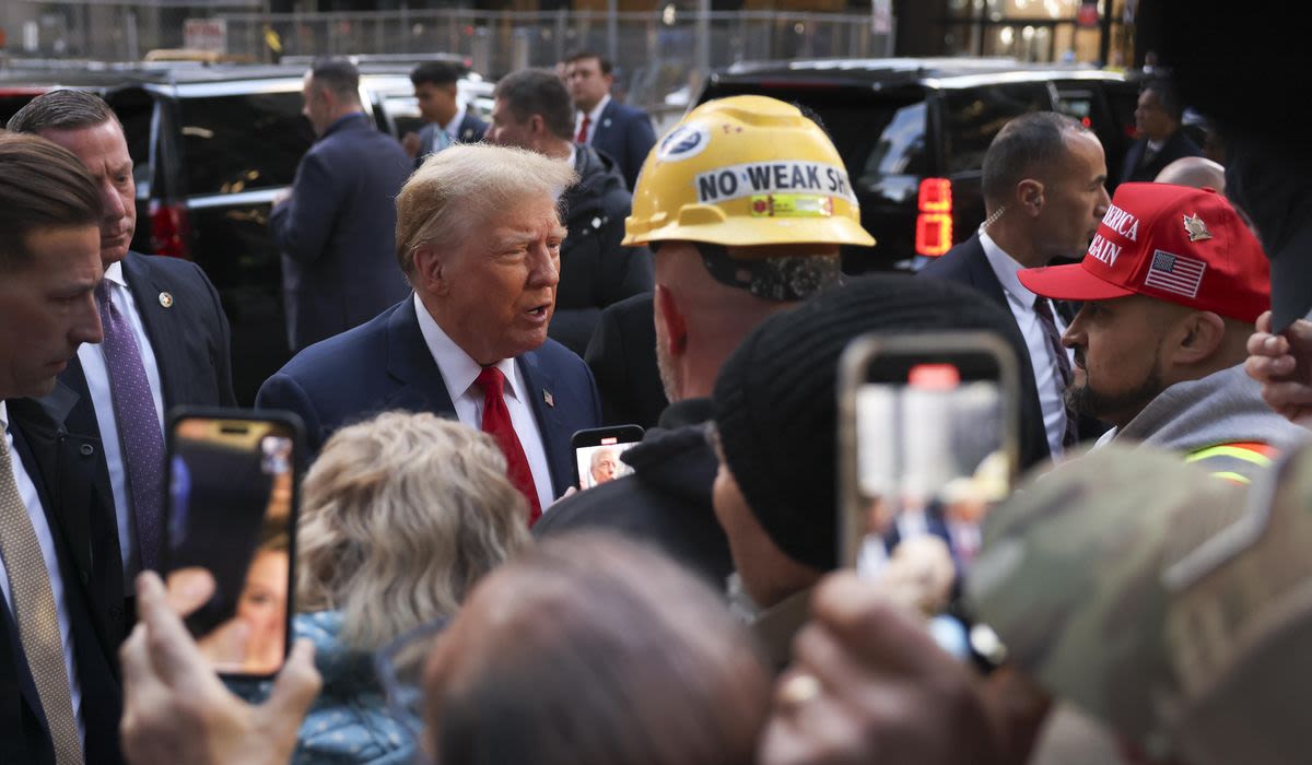 Court-bound Trump gets warm, raucous reception at Manhattan construction site