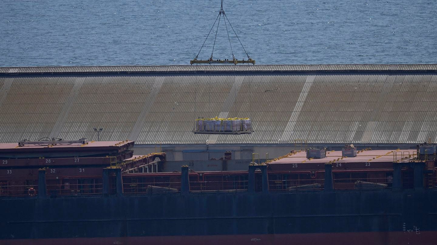 Aid on its way to US-led Gaza pier, but delivery is unclear