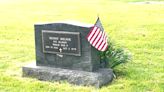 Volunteers place flags on veterans’ graves for upcoming Memorial Day