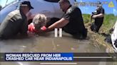 Woman rescued after car crashes, flips over into creek near Indianapolis: VIDEO