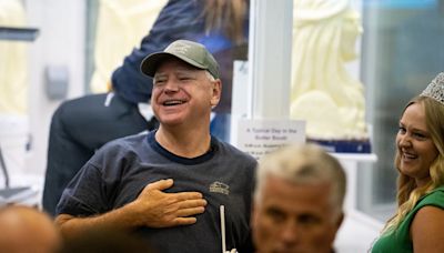 Tim Walz aims donut jibe at JD Vance on visit to Pennsylvania farmers’ market