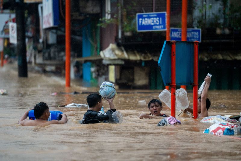 Floods, flights cancelled as Typhoon Gaemi dumps heavy rain on Manila