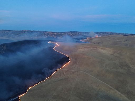 California firefighters continue battling wind-driven wildfire east of San Francisco