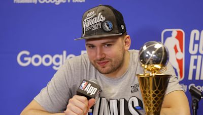 Michael Finley Hilariously Takes Luka Doncic’s Beer During Dallas Mavericks' Postgame Celebration